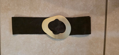 brown belt with a large gold buckle