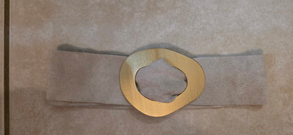beige belt with gold buckle